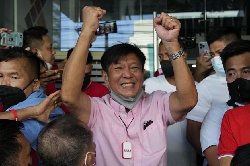 Presidential candidate Ferdinand &quot;Bongbong&quot; Marcos Jr. celebrates outside his headquarters in Mandaluyong, Philippines on Wednesday, May 11, 2022. Filipino voters overwhelmingly elected Ferdinand &quot;Bongbong&quot; Marcos Jr., as president during the May 2022 elections, completing a stunning return to power for the family of the late President Ferdinand Marcos, Sr., who ruled the country for more than two decades until being ousted in 1986 in the nonviolent &quot;People Power&quot; revolution. (AP Photo/Aaron Favila,File)