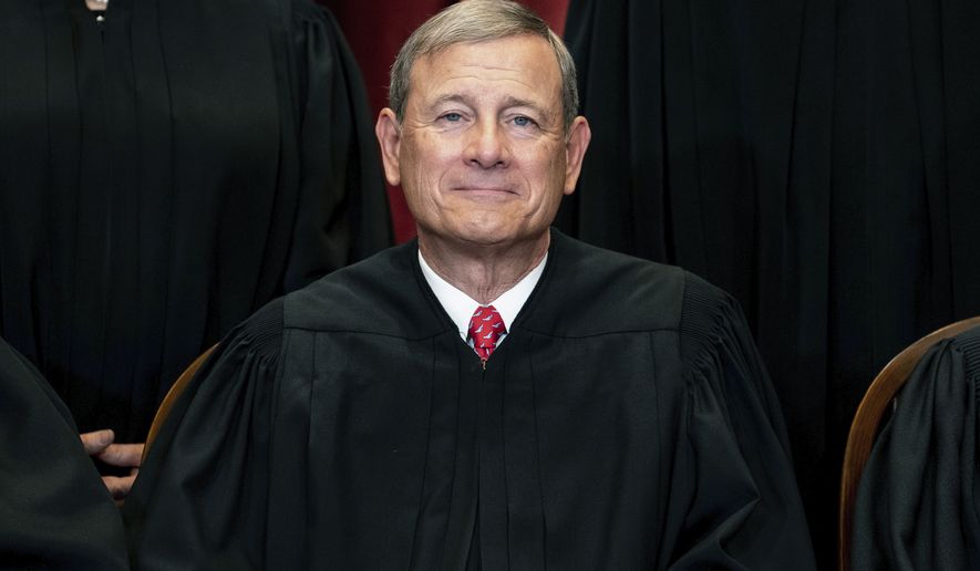 FILE - In this April 23, 2021, file photo Chief Justice John Roberts sits during a group photo at the Supreme Court in Washington. The Supreme Court has ended constitutional protections for abortion that had been in place nearly 50 years — a decision by its conservative majority to overturn the court&#39;s landmark abortion cases.(Erin Schaff/The New York Times via AP, Pool, File)