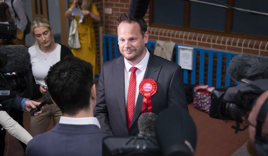 Labour candidate Simon Lightwood speaks to media, after winning the Wakefield by-election, following the by-election count at Thornes Park Stadium in Wakefield, West Yorkshire Friday, June 24, 2022. The by-election was triggered by the resignation of Imran Ahmad Khan following his conviction for sexual assault. (Danny Lawson/PA via AP)