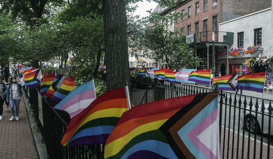 Flags affirming LGBTQ identity dress the fencing surrounding the Stonewall National Monument, Wednesday, June 22, 2022, in New York. Sunday&#39;s Pride Parade wraps a month marking the anniversary of the June 28th, 1969, Stonewall uprising, sparked by a police raid on a gay bar in Manhattan and a catalyst of the modern LGBTQ movement. (AP Photo/Bebeto Matthews)