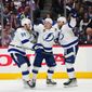 Tampa Bay Lightning left wing Ondrej Palat (18) celebrates a goal against the Colorado Avalanche with Mikhail Sergachev (98) and Steven Stamkos (91) during the third period in Game 5 of the NHL hockey Stanley Cup Final, Friday, June 24, 2022, in Denver. (AP Photo/Jack Dempsey)