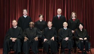 FILE - Members of the Supreme Court pose for a group photo at the Supreme Court in Washington, April 23, 2021. Seated from left are Associate Justice Samuel Alito, Associate Justice Clarence Thomas, Chief Justice John Roberts, Associate Justice Stephen Breyer and Associate Justice Sonia Sotomayor, Standing from left are Associate Justice Brett Kavanaugh, Associate Justice Elena Kagan, Associate Justice Neil Gorsuch and Associate Justice Amy Coney Barrett. The Supreme Court has ended constitutional protections for abortion that had been in place nearly 50 years — a decision by its conservative majority to overturn the court&#39;s landmark abortion cases. (Erin Schaff/The New York Times via AP, Pool, File)