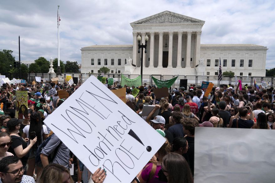 Protesters gather outside the Supreme Court in Washington, Friday, June 24, 2022. The Supreme Court has ended constitutional protections for abortion that had been in place nearly 50 years, a decision by its conservative majority to overturn the court&#39;s landmark abortion cases. (AP Photo/Jose Luis Magana)
