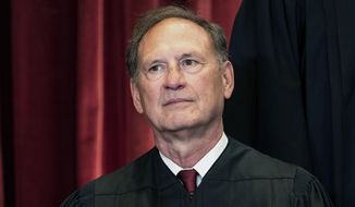 Associate Justice Samuel Alito sits during a group photo at the Supreme Court in Washington, April 23, 2021. The Supreme Court has ended constitutional protections for abortion that had been in place nearly 50 years — a decision by its conservative majority to overturn the court&#x27;s landmark abortion cases. (Erin Schaff/The New York Times via AP, Pool, File)