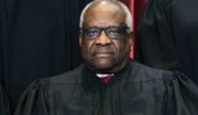 Associate Justice Clarence Thomas sits during a group photo at the Supreme Court in Washington, Friday, April 23, 2021. The Supreme Court&#39;s sweeping rulings on guns and abortion were the latest and perhaps clearest manifestation of how the court has evolved over the past six years, a product of historical accident and Republican political brute force, from an institution that leaned right, but produced some notable liberal victories, to one with an aggressive, 6-3 conservative majority. (Erin Schaff/The New York Times via AP, Pool)
