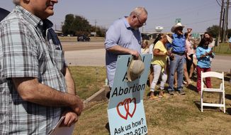 CORRECTS PROTESTERS ARE ANTI-ABORTION PROTESTERS - Members of Pro-Life WacoPro gather outside the Planned Parenthood Clinic, Friday, June 24, 2022, in Waco, Texas for a rally that included expressing their views on the Supreme Court&#39;s decision to overturn Roe v. Wade. The Supreme Court has ended constitutional protections for abortion that had been in place nearly 50 years in a decision by its conservative majority to overturn Roe v. Wade. Friday&#39;s outcome is expected to lead to abortion bans in roughly half the states. (Rod Aydelotte/Waco Tribune-Herald via AP) Pro-Life Waco