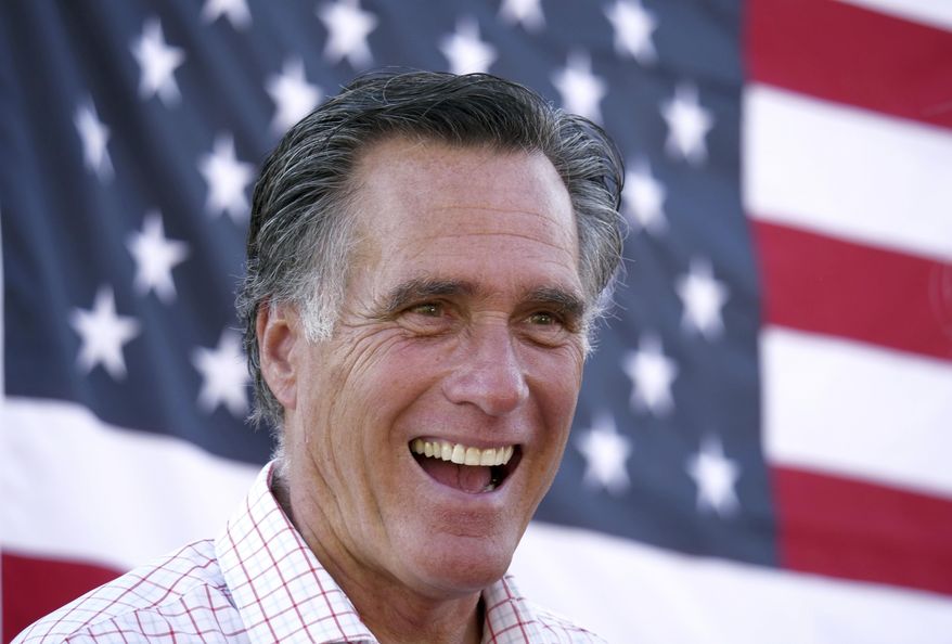 FILE - In this June 20, 2018, file photo, Mitt Romney smiles during a campaign event in American Fork, Utah. Mitt Romney isn&#39;t up for reelection this year, but his name is surfacing in Republican primaries throughout the nation. Candidates are using the label &amp;quot;Mitt Romney Republican&amp;quot; to frame opponents as insufficiently conservative and enemies of the Trump-era GOP Candidates have employed the concept in attack ads and talking points in Michigan, Ohio and Pennsylvania. (AP Photo/Rick Bowmer, File)