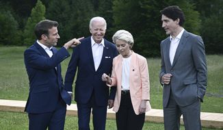 From left, President Emmanuel Macron, US President Joe Biden, European Commission President Ursula von der Leyen and Canada&#39;s Prime Minister Justin Trudeau leave after posing for a group photo , during the G7 Summit, at Castle Elmau in Kruen, near Garmisch-Partenkirchen, Germany, Sunday, June 26, 2022. The Group of Seven leading economic powers are meeting in Germany for their annual gathering Sunday through Tuesday. (Brendan Smialowski/Pool via AP)