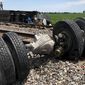 In this photo provided by Dax McDonald, debris sits near railroad tracks after an Amtrak passenger train derailed near Mendon, Mo., on Monday, June 27, 2022. The Southwest Chief, traveling from Los Angeles to Chicago, was carrying about 243 passengers when it collided with a dump truck near Mendon, Amtrak spokeswoman Kimberly Woods said. (Dax McDonald via AP)