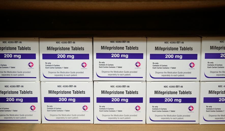 In this file photo, boxes of the drug mifepristone line a shelf at the West Alabama Women&#x27;s Center in Tuscaloosa, Ala., on Wednesday, March 16, 2022.  Women seeking medication abortion from Planned Parenthood of Montana will now be required to show proof of residency in a bid to prevent the sale of pills to women from states where abortions are banned. (AP Photo/Allen G. Breed, File)  **FILE**