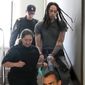WNBA star and two-time Olympic gold medalist Brittney Griner is escorted to a courtroom for a hearing, in Khimki just outside Moscow, Russia, Monday, June 27, 2022. More than four months after she was arrested at a Moscow airport for cannabis possession, American basketball star Griner is to appear in court Monday for a preliminary hearing ahead of her trial. (AP Photo/Alexander Zemlianichenko)