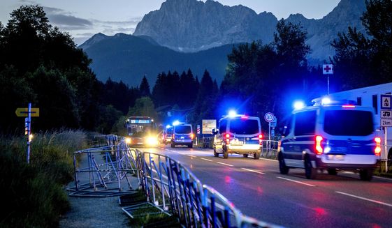 Police forces drive to Elmau near Garmisch-Partenkirchen, Germany Monday, June 27, 2022. The G-7 leaders will begin Monday&#39;s session of their three-day summit with a focus on Ukraine. (AP Photo/Michael Probst)