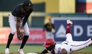 Washington Nationals&#39; Josh Bell, right, is forced out at second base by Pittsburgh Pirates shortstop Oneil Cruz, left, during the third inning of a baseball game at Nationals Park, Monday, June 27, 2022, in Washington. (AP Photo/Alex Brandon)