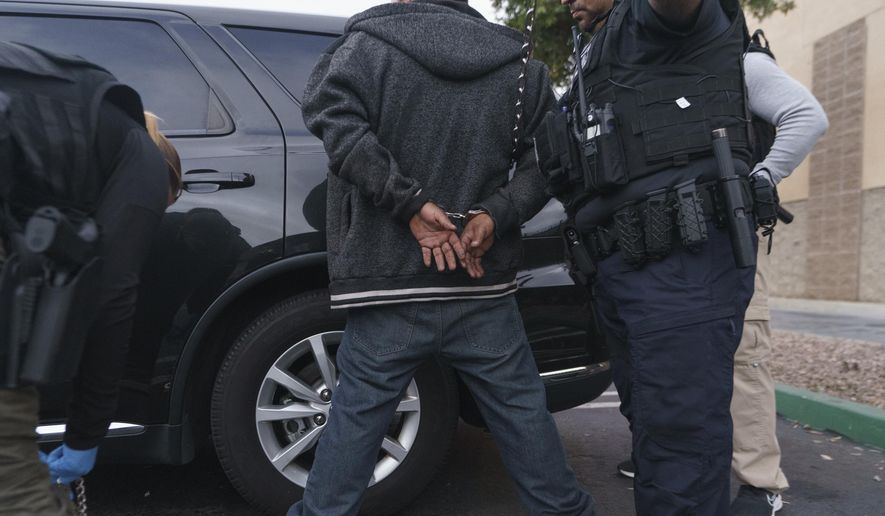 U.S. Immigration and Customs Enforcement agents arrest an immigrant considered a threat to public safety and national security during an early morning raid in Compton, Calif., Monday, June 6, 2022. (AP Photo/Damian Dovarganes) **FILE**