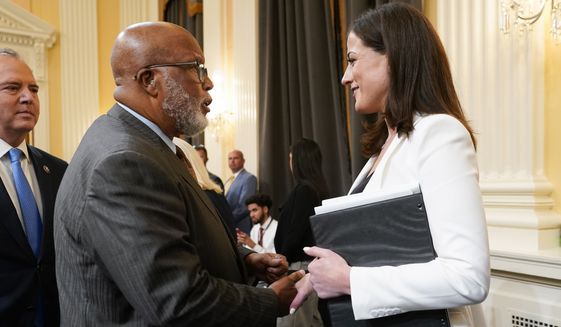 Chairman Bennie Thompson, D-Miss., talks with Cassidy Hutchinson, former aide to Trump White House chief of staff Mark Meadows, after she testified as the House select committee investigating the Jan. 6 attack on the U.S. Capitol holds a hearing at the Capitol in Washington, Tuesday, June 28, 2022. (AP Photo/J. Scott Applewhite)