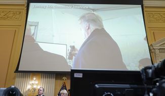 A exhibit of a photo of former President Donald Trump backstage before he spoke at the Jan. 6 rally, is displayed as Cassidy Hutchinson, former aide to Trump White House chief of staff Mark Meadows, testifies as the House select committee investigating the Jan. 6 attack on the U.S. Capitol continues to reveal its findings of a year-long investigation, at the Capitol in Washington, Tuesday, June 28, 2022. (AP Photo/Jacquelyn Martin)