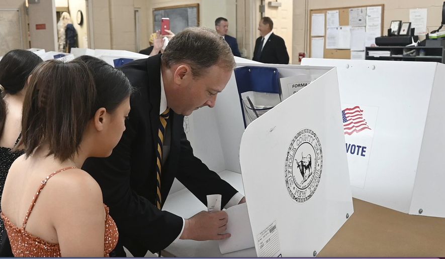 Republican candidate for governor and U.S. Rep. Lee Zeldin casts his vote for governor at the Mastic Beach firehouse on Tuesday, June. 28, 2022 in Mastic Beach, N.Y. A new poll shows Rep. Lee Zeldin, the Republican nominee for New York governor, closing the gap between himself and Democratic incumbent Gov. Kathy Hochul. (James Carbone/Newsday via AP)