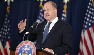 Colorado Gov. Jared Polis makes a point during a news conference to update the status of the state&#x27;s efforts against the coronavirus on Tuesday, April 20, 2021, in Denver. Colorado’s top Republican primary contests for U.S. Senate, secretary of state and governor will be held Tuesday, June 28.  (AP Photo/David Zalubowski) **FILE**