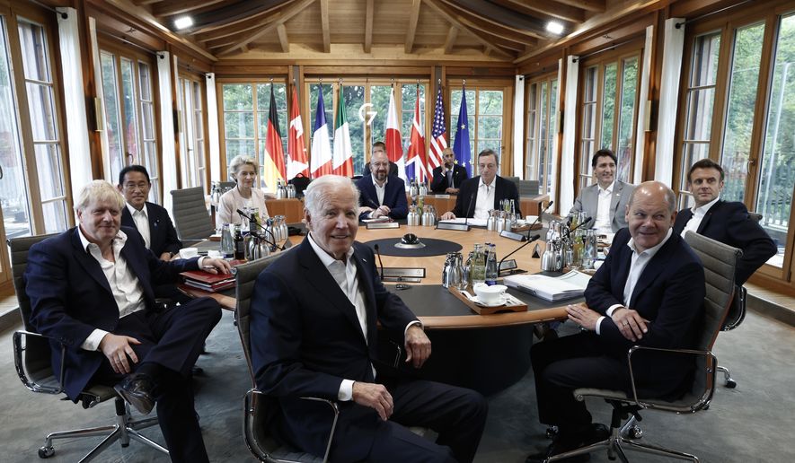 Clockwise from left, British Prime Minister Boris Johnson,  Japanese Prime Minister Fumio Kishida, the President of the European Commission Ursula von der Leyen, European Council President Charles Michel, Italian Prime Minister Mario Draghi, Canadian Prime Minister Justin Trudeau, French President Emmanuel Macron, German Chancellor Olaf Scholz and U.S. President Joe Biden attend a working session during of the G7 leaders summit at Castle Elmau in Kruen, near Garmisch-Partenkirchen, Germany, on Tuesday, June 28, 2022. The Group of Seven leading economic powers are meeting in Germany for their annual gathering Sunday through Tuesday. (Benoit Tessier/Pool Photo via AP)