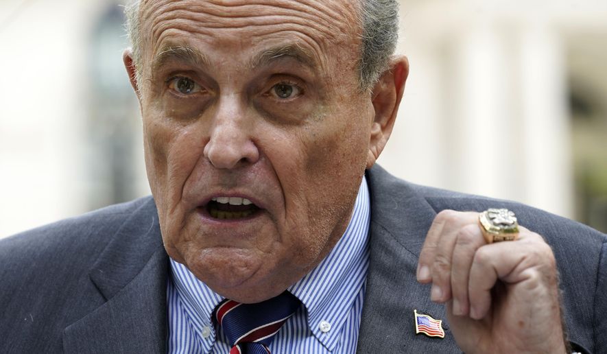 Former New York City Mayor Rudy Giuliani speaks during a news conference June 7, 2022, in New York. A heckler who clapped Giuliani on the back at a campaign event, Sunday, June 26, 2022, was arrested, jailed for more than 24 hours and now faces an assault charge. (AP Photo/Mary Altaffer, File)