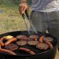 In this Wednesday, July 4, 2012 file photo, a man grills hamburgers and hot dogs in Arlington, Va. (AP Photo/Alex Brandon, File)