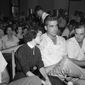 In this Sept. 22. 1955 photo, Carolyn Bryant rests her head on her husband Roy Bryant&#39;s shoulder after she testified in Emmett Till murder court case in Sumner, Miss. A team searching the basement of a Mississippi courthouse for evidence about the lynching of Black teenager Emmett Till has found the unserved warrant charging a white woman in his kidnapping in 1955, and relatives of the victim want authorities to finally arrest her nearly 70 years later. A warrant for the arrest of Carolyn Bryant Donham _ identified as Mrs. Roy Bryant on the document _ was discovered last week by searchers inside a file folder that had been placed in a box, Leflore County Circuit Clerk Elmus Stockstill told The Associated Press on Wednesday, June 29, 2022. (AP Photo, File)