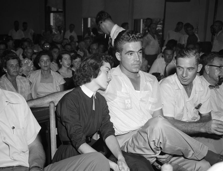 In this Sept. 22. 1955 photo, Carolyn Bryant rests her head on her husband Roy Bryant's shoulder after she testified in Emmett Till murder court case in Sumner, Miss. A team searching the basement of a Mississippi courthouse for evidence about the lynching of Black teenager Emmett Till has found the unserved warrant charging a white woman in his kidnapping in 1955, and relatives of the victim want authorities to finally arrest her nearly 70 years later. A warrant for the arrest of Carolyn Bryant Donham _ identified as Mrs. Roy Bryant on the document _ was discovered last week by searchers inside a file folder that had been placed in a box, Leflore County Circuit Clerk Elmus Stockstill told The Associated Press on Wednesday, June 29, 2022. (AP Photo, File)