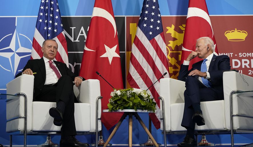 President Joe Biden, right, meets with Turkey&#39;s President Recep Tayyip Erdogan, left, during the NATO summit in Madrid, Wednesday, June 29, 2022. (AP Photo/Susan Walsh)