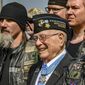 Hershel &quot;Woody&quot; Williams (center), the sole surviving U.S. Marine to be awarded the Medal of Honor during World War II, poses with fellow Marines at the Charles E. Shelton Freedom Memorial at Smothers Park, Saturday, April 6, 2019, in Owensboro, Ky. Williams, the last remaining Medal of Honor recipient from World War II, died Wednesday, June 29, 2022. He was 98. Williams&#39; foundation announced on Twitter and Facebook that he died at the Veterans Affairs medical center bearing his name in Huntington. (Greg Eans/The Messenger-Inquirer via AP) **FILE**