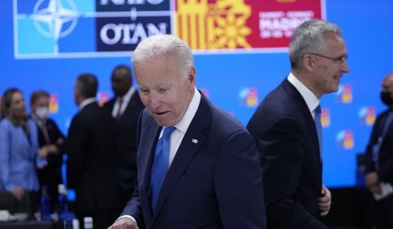 U.S. President Joe Biden, left, and NATO Secretary General Jens Stoltenberg arrive for a round table meeting at a NATO summit in Madrid, Spain on Wednesday, June 29, 2022. North Atlantic Treaty Organization heads of state will meet for a NATO summit in Madrid from Tuesday through Thursday. (AP Photo/Bernat Armangue)