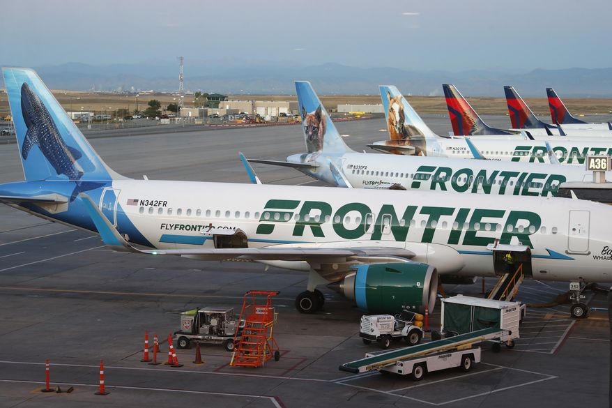Frontier Airlines jets sit at gates at Denver International Airport on Sept. 22, 2019, in Denver. (AP Photo/David Zalubowski, File)