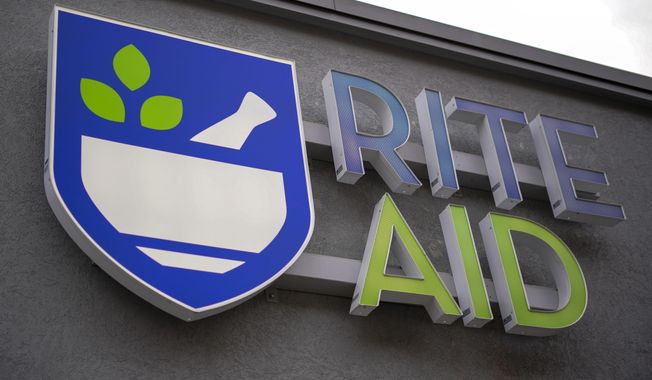 A Rite Aid logo is displayed on its store in Pittsburgh, on Jan. 12, 2022. (AP Photo/Gene J. Puskar, File)