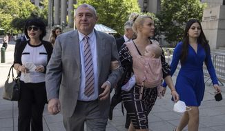 Lev Parnas, a former associate of Rudy Giuliani, arrives at the federal courthouse with his wife Svetlana Parnas in New York, Wednesday, June 29, 2022.  Parnas, who was convicted of campaign finance crimes at trial and later pleaded guilty to a separate fraud charge is asking that he be spared from prison at his sentencing. (AP Photo/Yuki Iwamura)