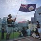 FILE - A protester waves Hong Kong British colony flag during continuing pro-democracy rallies in Tamar Park, Hong Kong, on Sept. 3, 2019. When the British handed its colony Hong Kong to Beijing in 1997, it was promised 50 years of self-government and freedoms of assembly, speech and press that are not allowed Chinese on the Communist-ruled mainland. As the city of 7.4 million people marks 25 years under Beijing&#39;s rule on Friday, those promises are wearing thin. Hong Kong&#39;s honeymoon period, when it carried on much as it always had, has passed, and its future remains uncertain, determined by forces beyond its control. (AP Photo/Vincent Yu, File)
