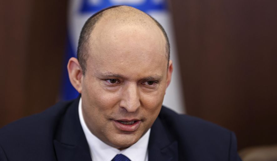 Israeli Prime Minister Naftali Bennett chairs a cabinet meeting at the prime minister&#39;s office in Jerusalem, Sunday, June 26, 2022. (Ronen Zvulun/Pool via AP)