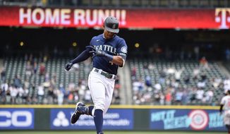 Seattle Mariners&#39; Julio Rodriguez rounds the bases after hitting a two-run home run against the Baltimore Orioles during the fourth inning of a baseball game, Wednesday, June 29, 2022, in Seattle. (AP Photo/Caean Couto)