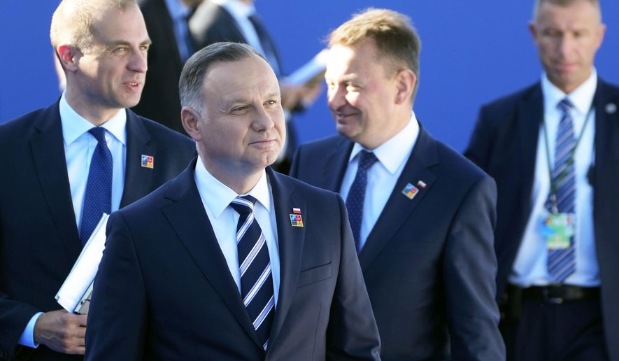 In this file photo, Poland&#39;s President Andrzej Duda, second left, arrives for the NATO summit in Madrid, Spain on Wednesday, June 29, 2022. North Atlantic Treaty Organization heads of state will meet for a NATO summit in Madrid from Tuesday through Thursday. (AP Photo/Paul White)  **FILE**
