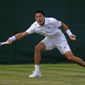 Brandon Nakashima of the US returns to Canada&#x27;s Denis Shapovalov in a second round men&#x27;s single match on day four of the Wimbledon tennis championships in London, Thursday, June 30, 2022. (AP Photo/Alastair Grant)