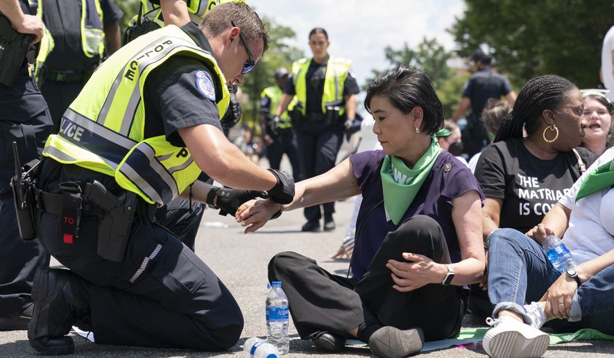 Rep. Judy Chu, D-Calif., is arrested by Capitol Police with over a hundred people during an act of civil disobedience during a protest for abortion rights, Thursday, June 30, 2022, in Washington. (AP Photo/Jacquelyn Martin)