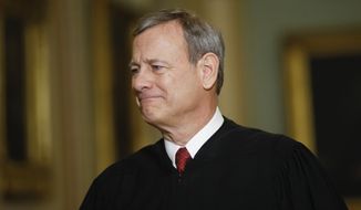 In this file photo, Chief Justice of the United States, John Roberts walks to the Senate chamber at the Capitol in Washington, Jan. 16, 2020. (AP Photo/Matt Rourke, File)  **FILE**