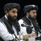 Zabiullah Mujahid, left, the spokesman for the Taliban government, speaks during a press conference in Kabul, Afghanistan, Thursday, June 30, 2022. Afghanistan&#39;s Taliban rulers held a gathering Thursday of some 3,000 Islamic clerics and tribal elders for the first time since seizing power in August, urging them to advise them on running the country. Women were not allowed to attend. (AP Photo/Ebrahim Noroozi)