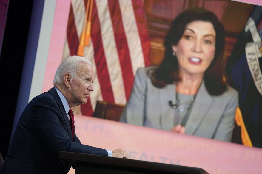 President Joe Biden listens as New York Gov. Kathy Hochul speaks during a virtual meeting with Democratic governors on the issue of abortion rights, in the South Court Auditorium on the White House campus, Friday, July 1, 2022, in Washington. (AP Photo/Evan Vucci)