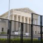 Police barriers are visible in front of the Supreme Court in Washington, Friday, July 1, 2022. (AP Photo/Andrew Harnik)