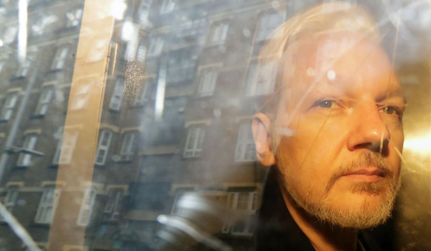Buildings are reflected in the window as WikiLeaks founder Julian Assange is taken from court, where he appeared on charges of jumping British bail seven years ago, in London, Wednesday May 1, 2019. Assange has appealed against the British&#39;s government decision last month to order his extradition to the U.S. The appeal was filed Friday, July 1, 2022, at the High Court, the latest twist in a decade-long legal saga sparked by his website&#39;s publication of classified U.S. documents. (AP Photo/Matt Dunham, File)