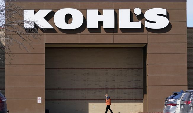 In this Feb. 25, 2021, file photo, a woman arrives at a Kohl&#x27;s store in West Des Moines, Iowa. Kohl&#x27;s board has nixed a deal to be bought by Franchise Group, Friday, July 1, 2022, citing a poor retail environment caused by rising inflation that has consumers pulling back on spending. (AP Photo/Charlie Neibergall, File)