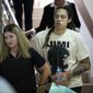 WNBA star and two-time Olympic gold medalist Brittney Griner is escorted to a courtroom for a hearing, in Khimki just outside Moscow, Russia, Friday, July 1, 2022. U.S. basketball star Brittney Griner is set to go on trial in a Moscow-area court Friday. The proceedings that are scheduled to begin Friday come about 4 1/2 months after she was arrested on cannabis possession charges at an airport while traveling to play for a Russian team. (AP Photo/Alexander Zemlianichenko)