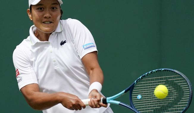 France&#x27;s Harmony Tan returns to Britain&#x27;s Katie Boulter during their women&#x27;s third round singles match on day six of the Wimbledon tennis championships in London, Saturday, July 2, 2022. (AP Photo/Alberto Pezzali)
