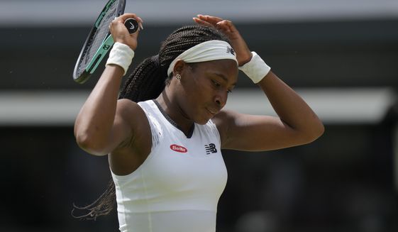 Coco Gauff of the US is dejected after losing a point to Amanda Anisimova of the US in a third round women&#39;s singles match on day six of the Wimbledon tennis championships in London, Saturday, July 2, 2022. (AP Photo/Alastair Grant)