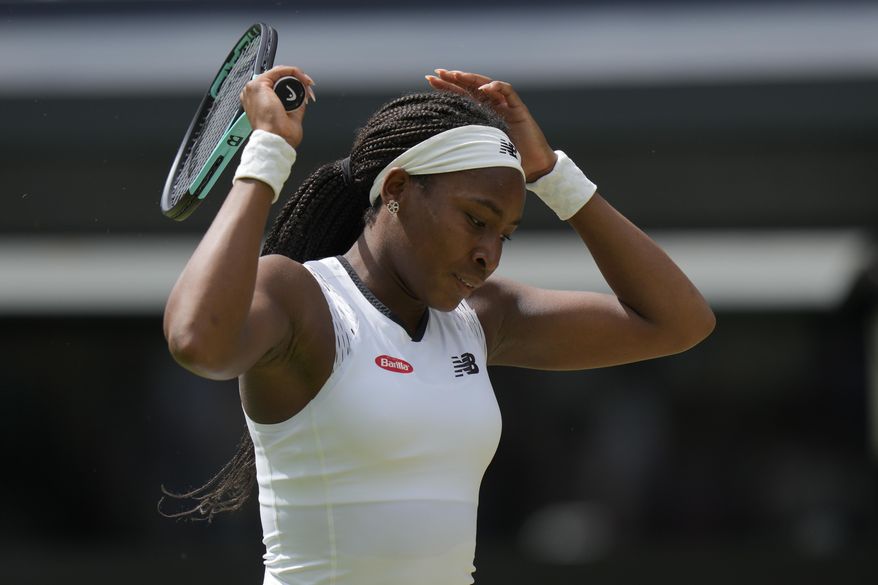 Coco Gauff of the US is dejected after losing a point to Amanda Anisimova of the US in a third round women&#39;s singles match on day six of the Wimbledon tennis championships in London, Saturday, July 2, 2022. (AP Photo/Alastair Grant)