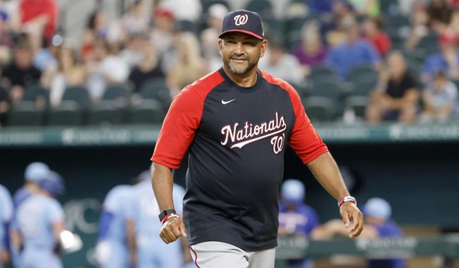 Washington Nationals manager Dave Martinez walks toward the dugout after making a pitching change during the seventh inning of a baseball game against the Texas Rangers Sunday, June 26, 2022, in Arlington, Texas. (AP Photo/Michael Ainsworth)